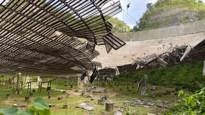 A view from beneath the collapsed dish of the Arecibo Observatory radio telescope.